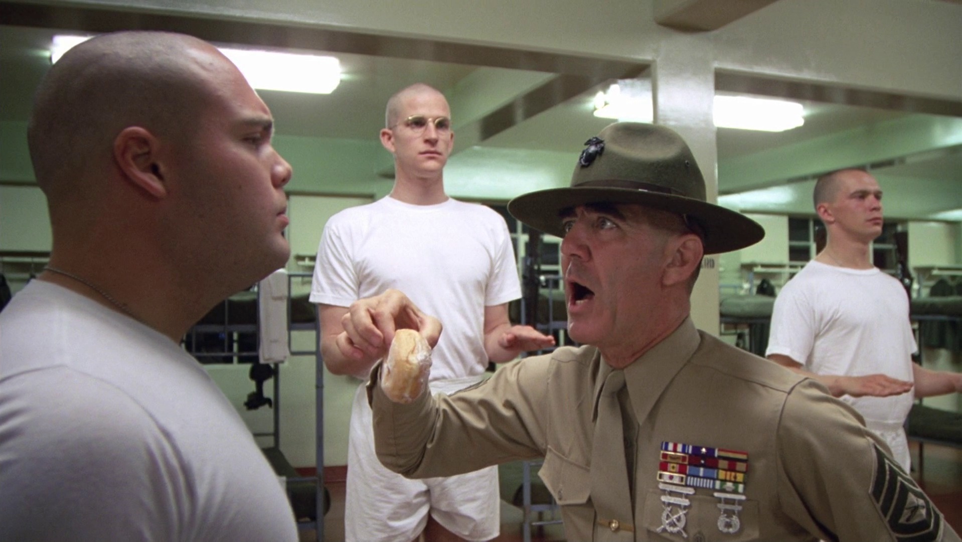 Gunnery Sergeant Hartman (R. Lee Ermey) aggressively confronts Private Pyle (Vincent D'Onofrio) during Marine Corps boot camp