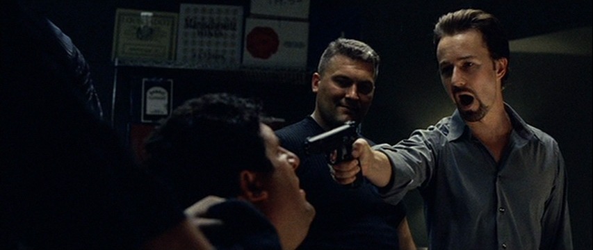 Monty Brogan aggressively holds a gun against Kostya Novotny, after it was revealed Novotny betrayed Brogan.
